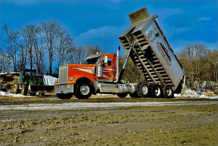 An Eastside Bulk dump truck tipping its body